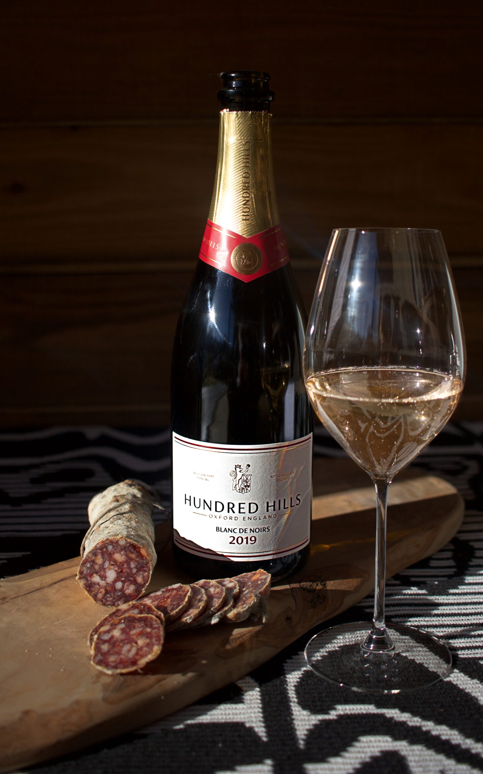 Charcuterie, bottle and glass