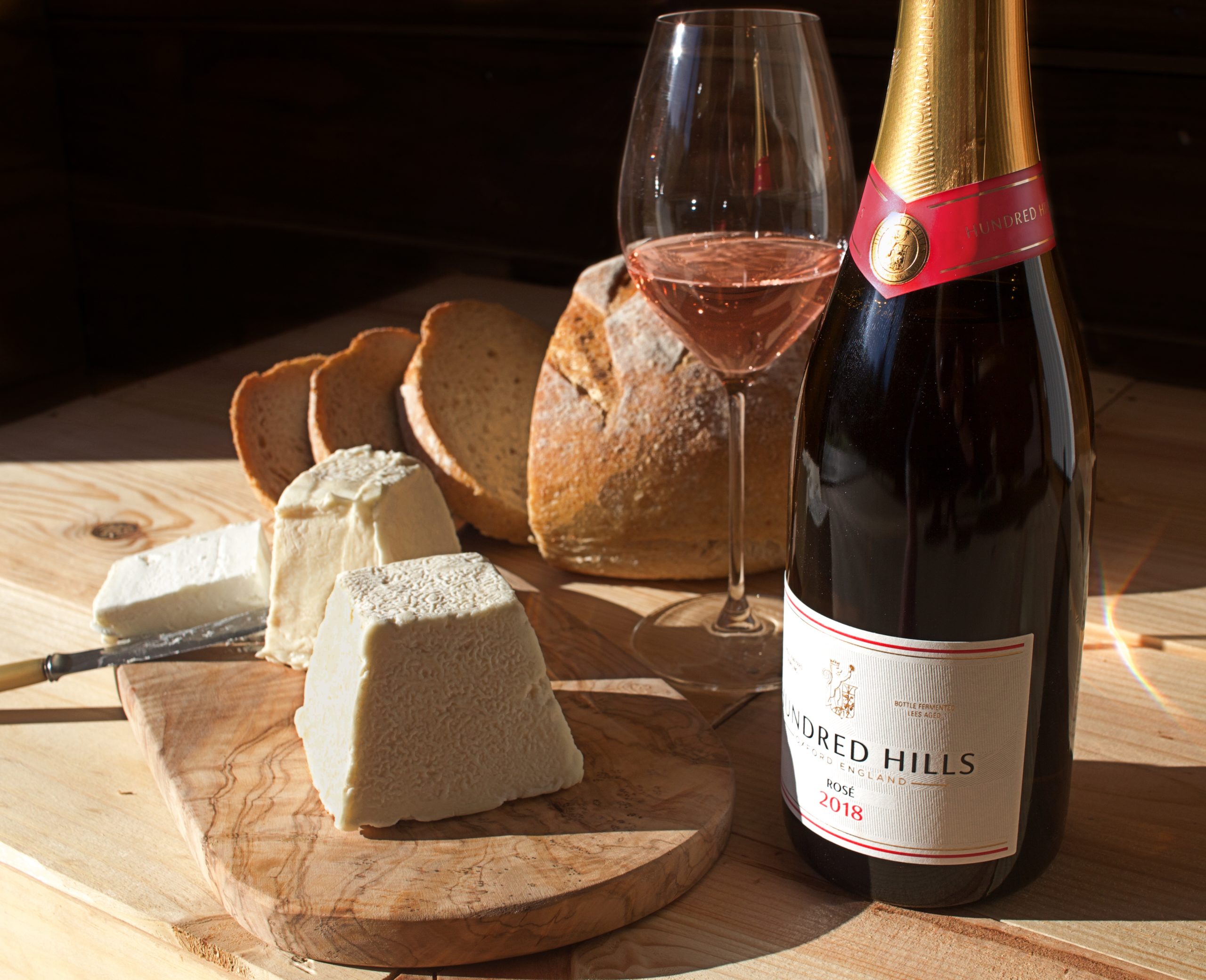 Cheese, bread, glass and bottle